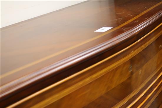 A mahogany serpentine inlaid chest of drawers W.110cm